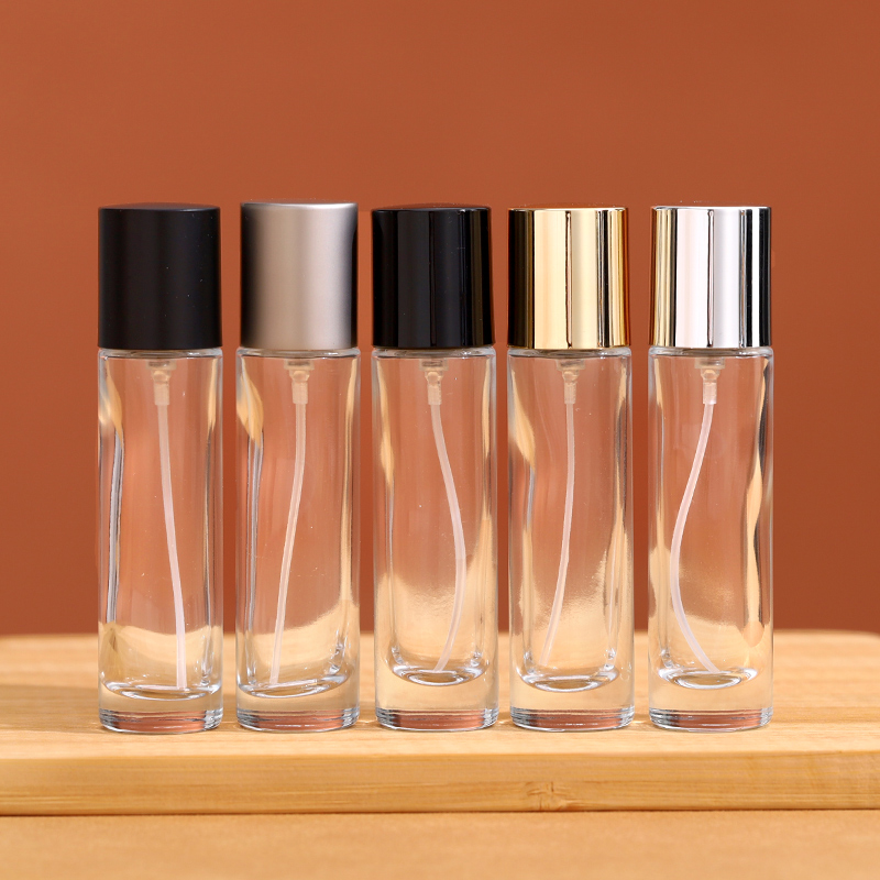 15ml slim clear cylindrical glass perfume bottle with matte black and gold caps, 25mm diameter