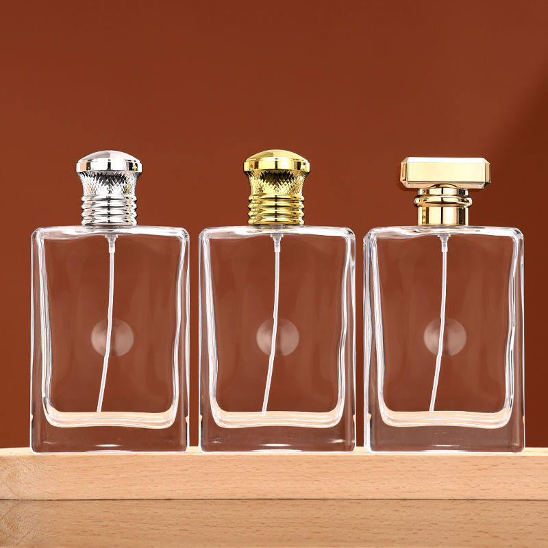 RX022-HYD802 100ml clear rectangular glass perfume bottle with gold and silver caps and crimp sprayer