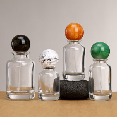 Clear round glass perfume bottles with gold and silver sprayers and Marbleized resin ball caps, 30ml 50ml 100ml