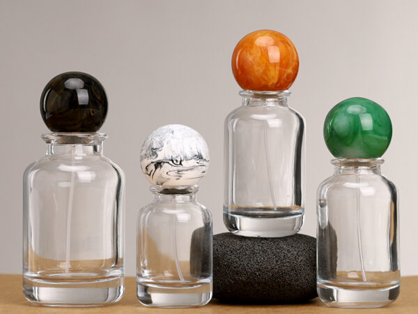 Clear round glass perfume bottles with gold and silver sprayers and Marbleized resin ball caps, 30ml 50ml 100ml