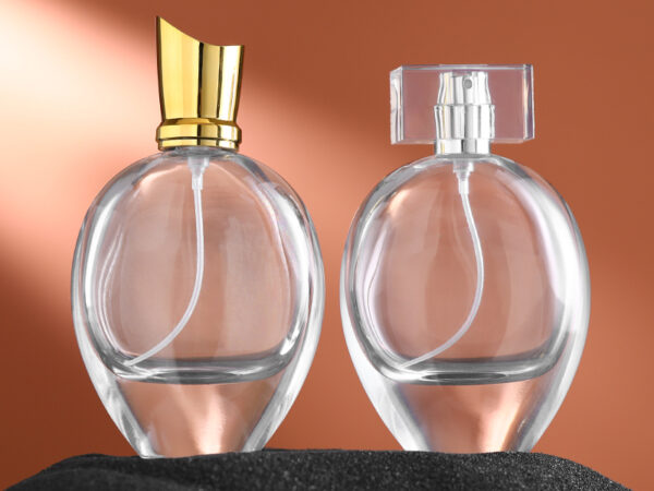 75ml transparent oval glass perfume bottle with gold silver sprayers and luxury acrylic electroplated lids