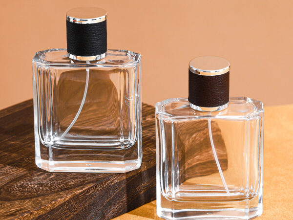 RX017-XB179 100ml clear square glass perfume bottle with black and brown embossed leather caps and silver gold sprayers