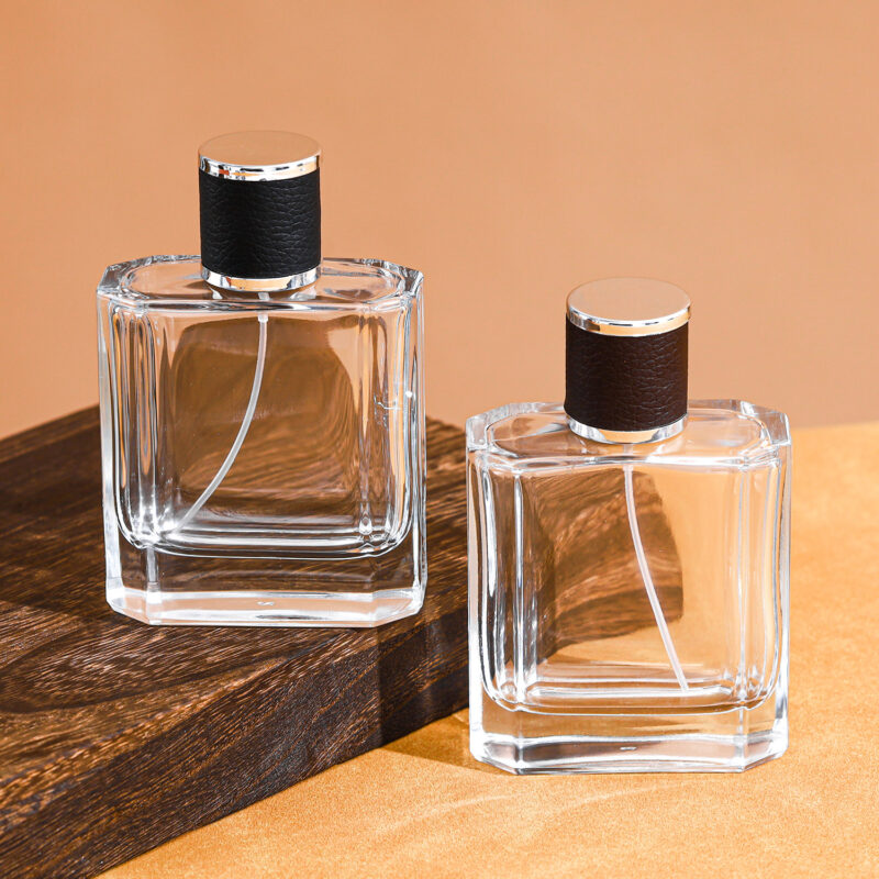RX017-XB179 100ml clear square glass perfume bottle with black and brown embossed leather caps and silver gold sprayers