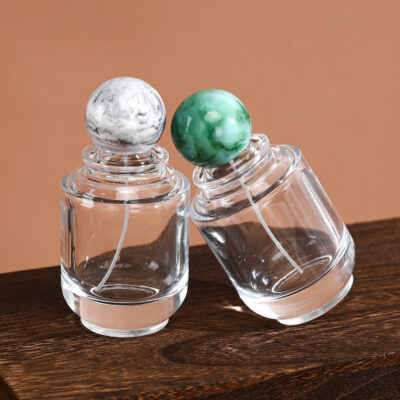 RX020-XB227 100ml Circular Glass Perfume Bottle with Large Marble Resin Sphere Cap