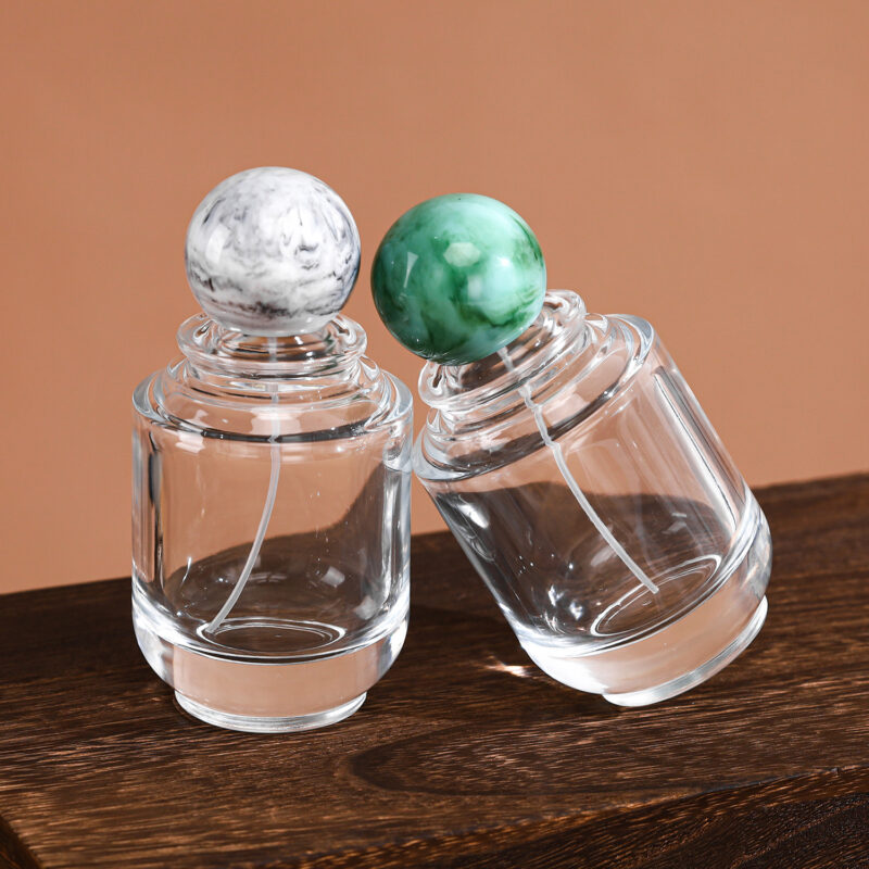 RX020-XB227 100ml Circular Glass Perfume Bottle with Large Marble Resin Sphere Cap