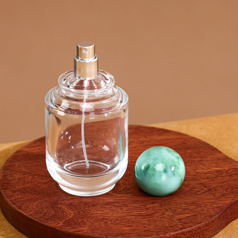 RX020-XB227 100ml Circular Glass Perfume Bottle with Large Marble Resin Sphere Cap