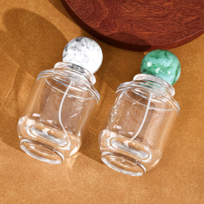 RX020-XB227 100ml Circular Glass Perfume Bottle with Large Marble Resin Sphere Cap