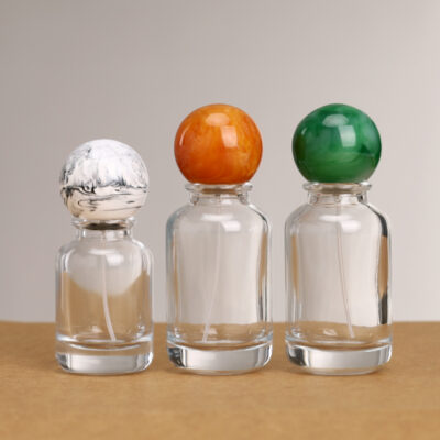 Clear round glass perfume bottles with gold and silver sprayers and Marbleized resin ball caps, 30ml 50ml 100ml