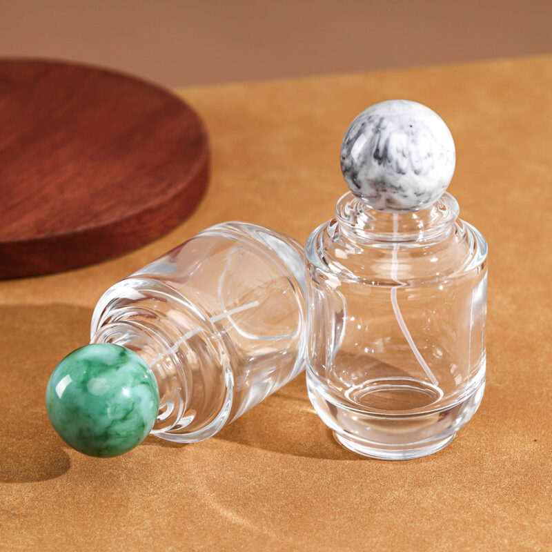 RX020-XB227 100ml Circular Glass Perfume Bottle with Large Marble Resin Sphere Cap