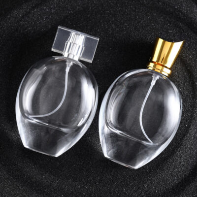 75ml transparent oval glass perfume bottle with gold silver sprayers and luxury acrylic electroplated lids