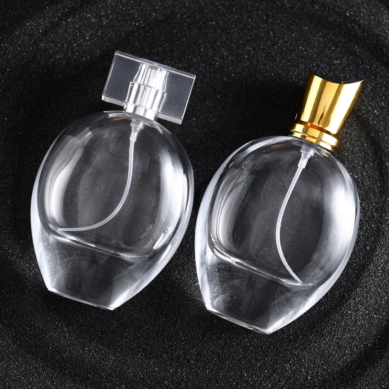 75ml transparent oval glass perfume bottle with gold silver sprayers and luxury acrylic electroplated lids