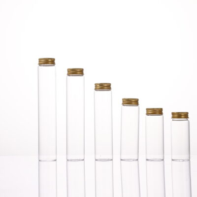 Clear glass vial with pre-painted golden aluminum screw cap
