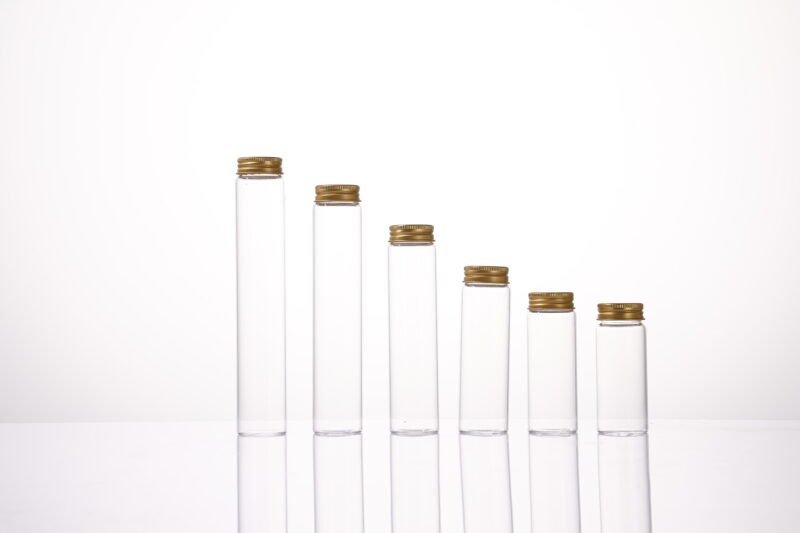 Clear glass vial with pre-painted golden aluminum screw cap