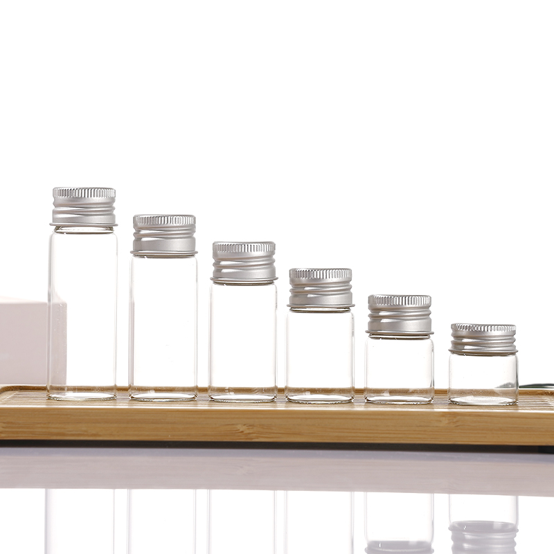 Clear borosilicate glass vials with silver aluminum screw caps, 5ml to 20ml+