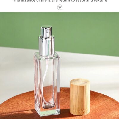 Clear glass perfume bottle with fine mist sprayer and natural bamboo overcap