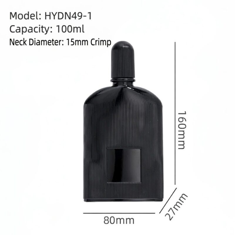 Matte black ribbed glass perfume bottle with gold and black atomizers and matching fluted caps